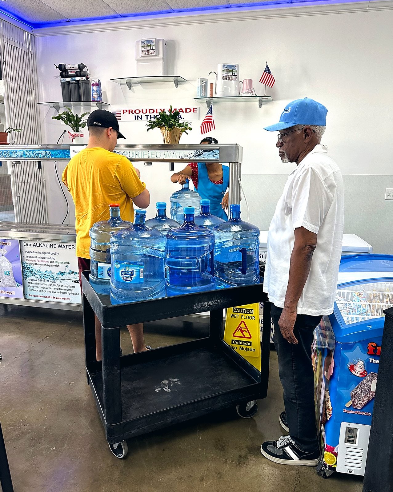 Customers loading full 5-gallon bottles in our store