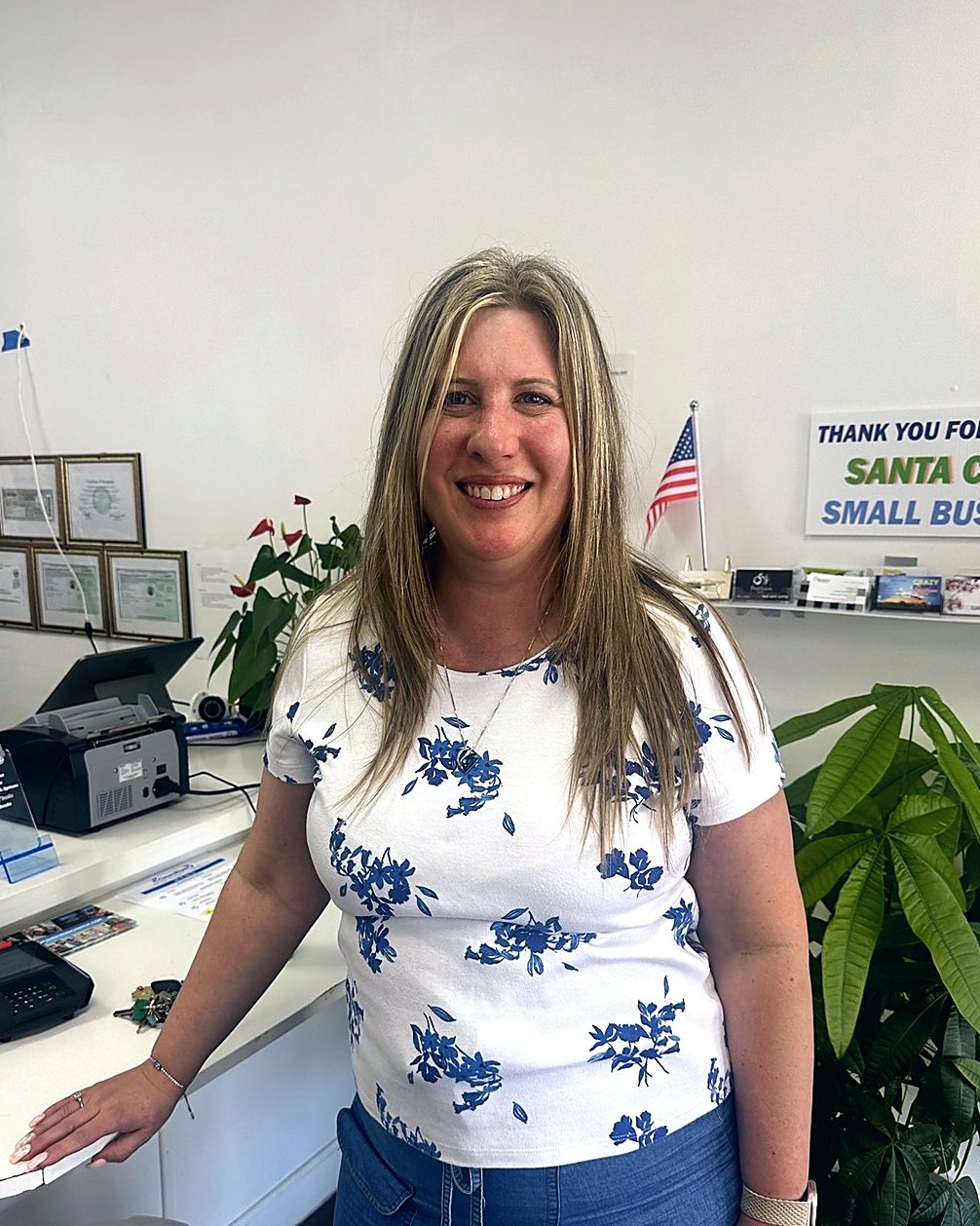 Smiling at the counter of the Clean River Water Store