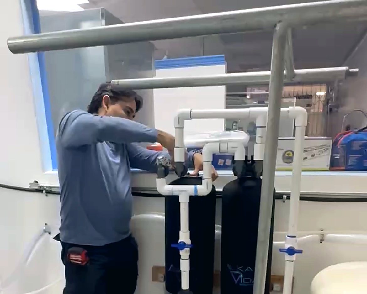 Our technician installing an AlkaVida filtration system